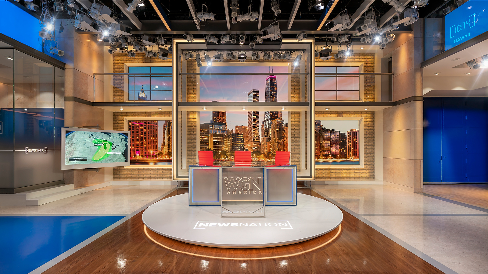 One of the anchor desk positions inside Studio 3, using the large LED wall with a Chicago skyline.