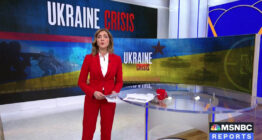 A news anchor standing in front of a 'Ukraine Crisis' graphic